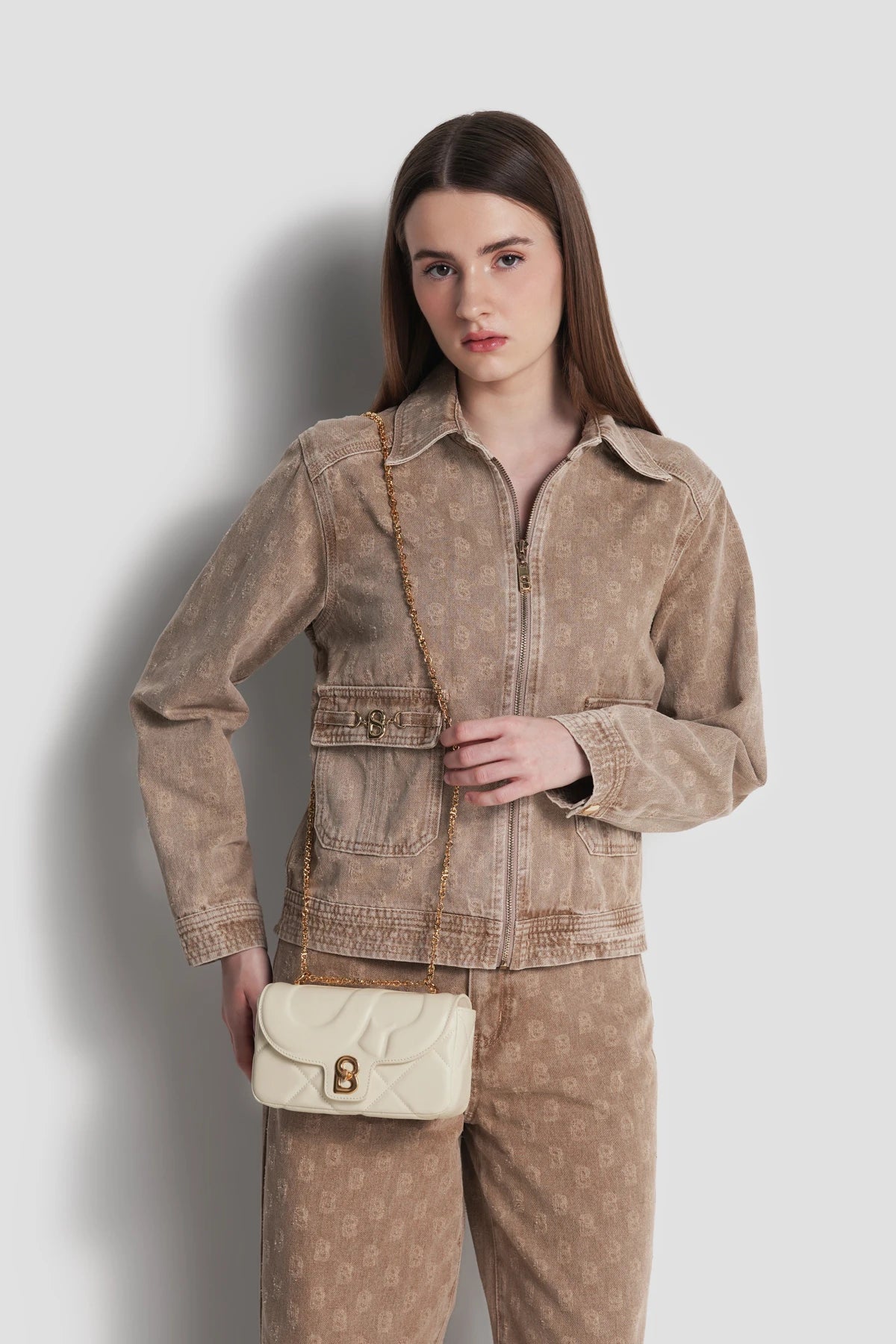 alana small bag in beige by buttonscarves carried as sling bag