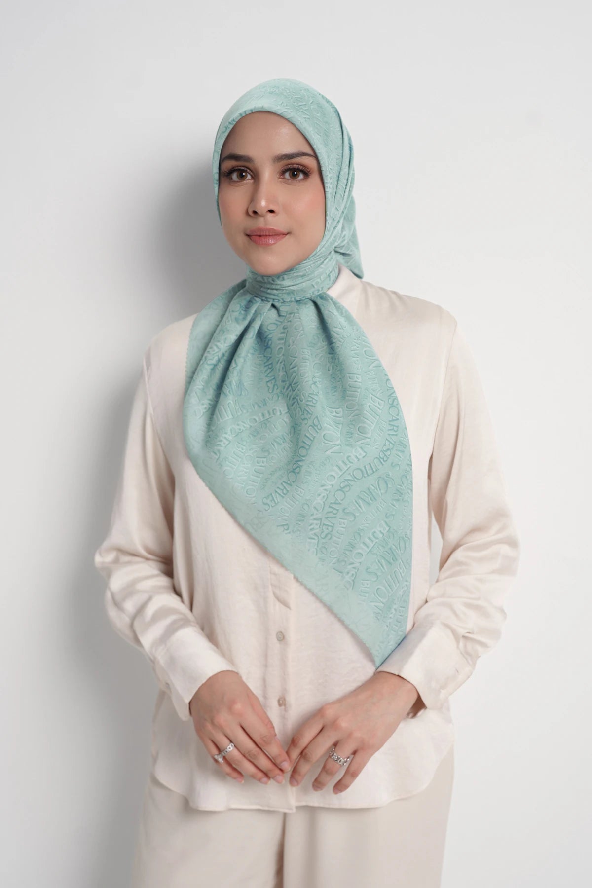 waves monogram printed square scarf in turquoise by buttonscarves front view