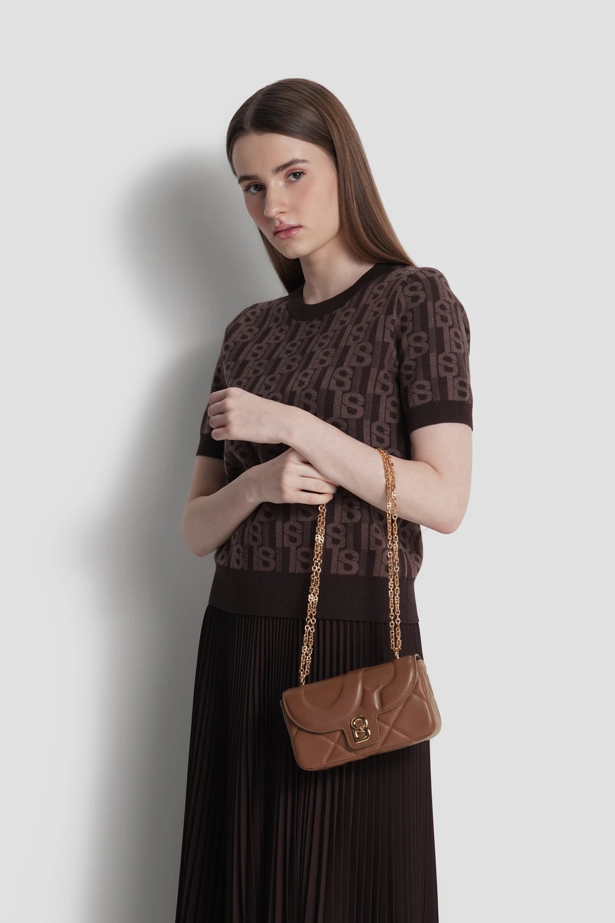 alana small bag in brown by buttonscarves carried on wrist