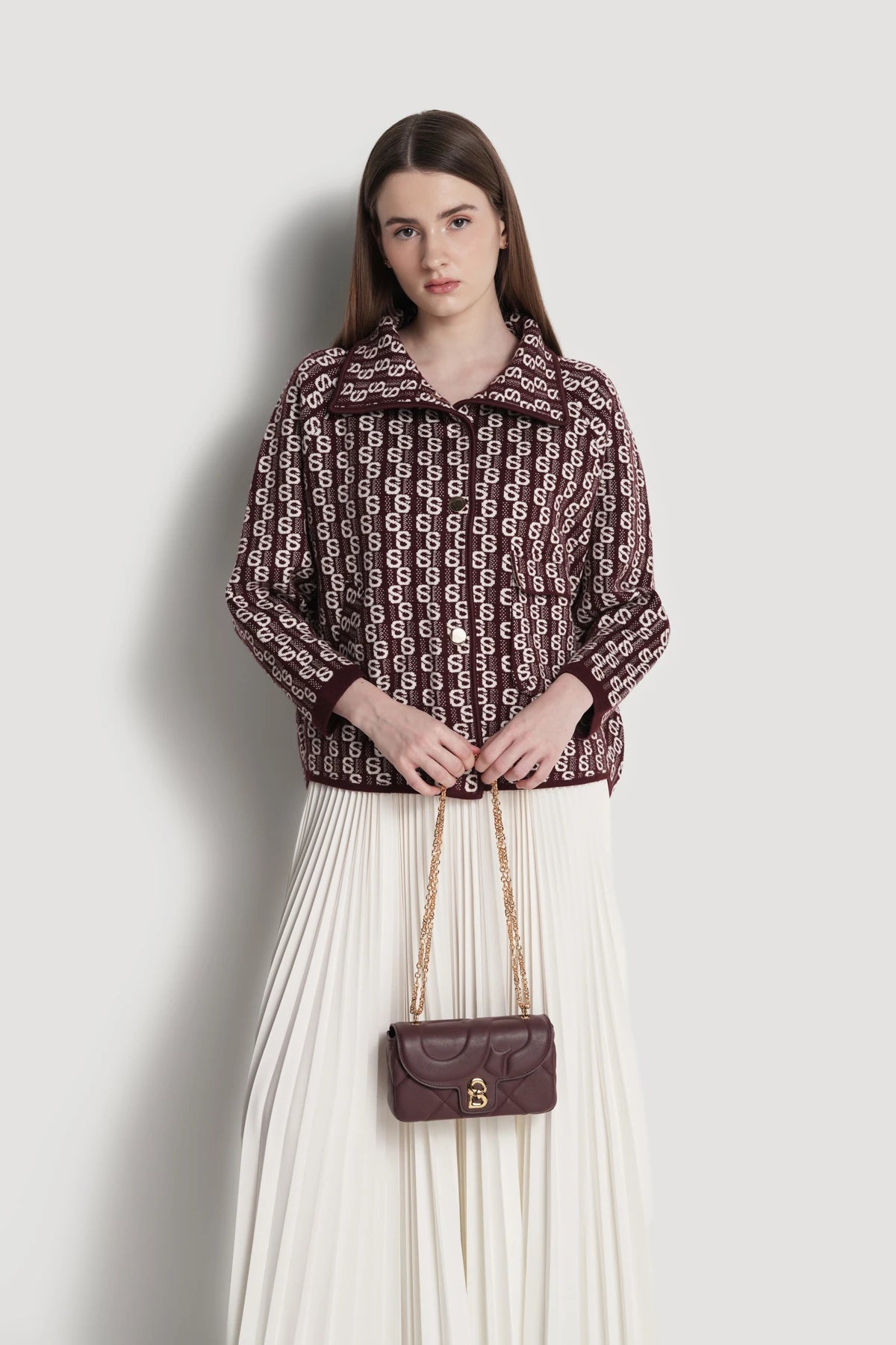 alana small bag in burgundy by buttonscarves carried by hand