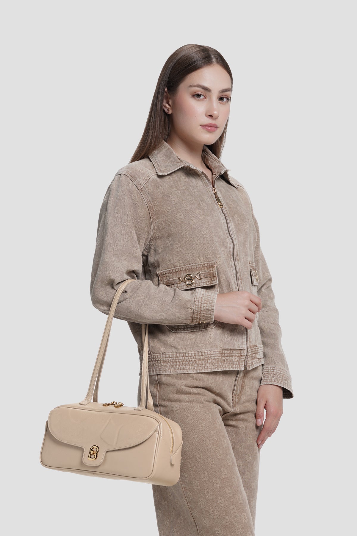 bria shoulder bag in clay by buttonscarves carried on wrist