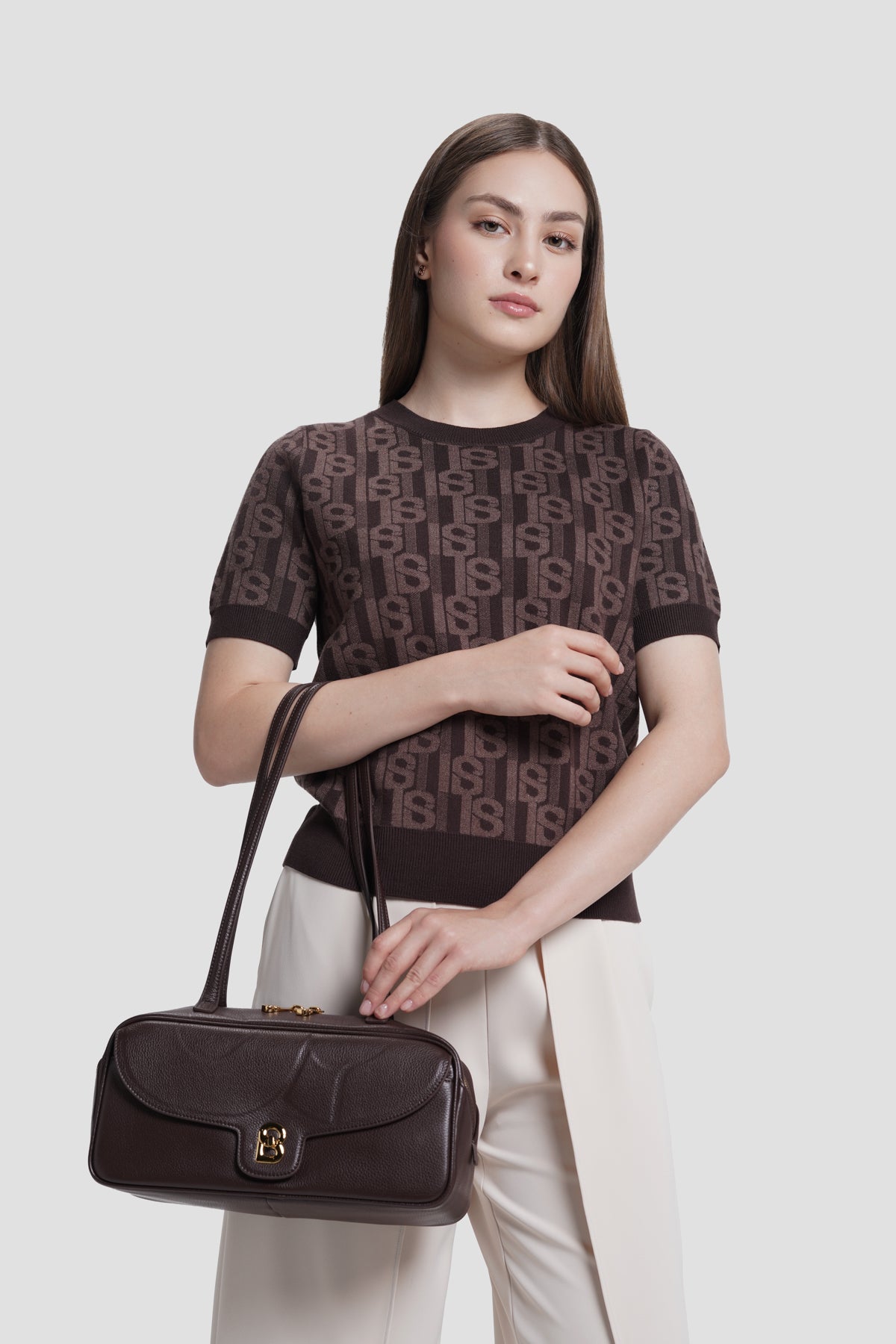 bria shoulder bag in dark brown by buttonscarves carried on wrist