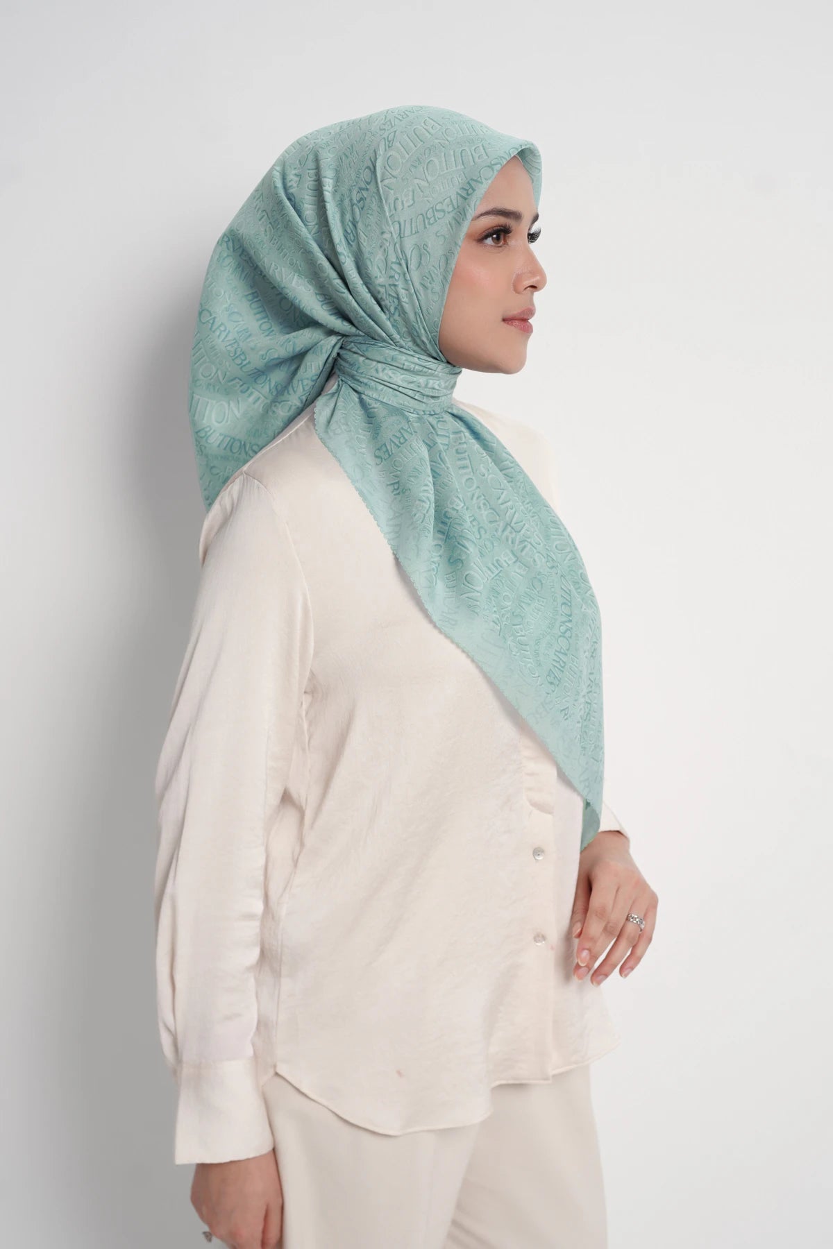 waves monogram printed square scarf in turquoise by buttonscarves side view