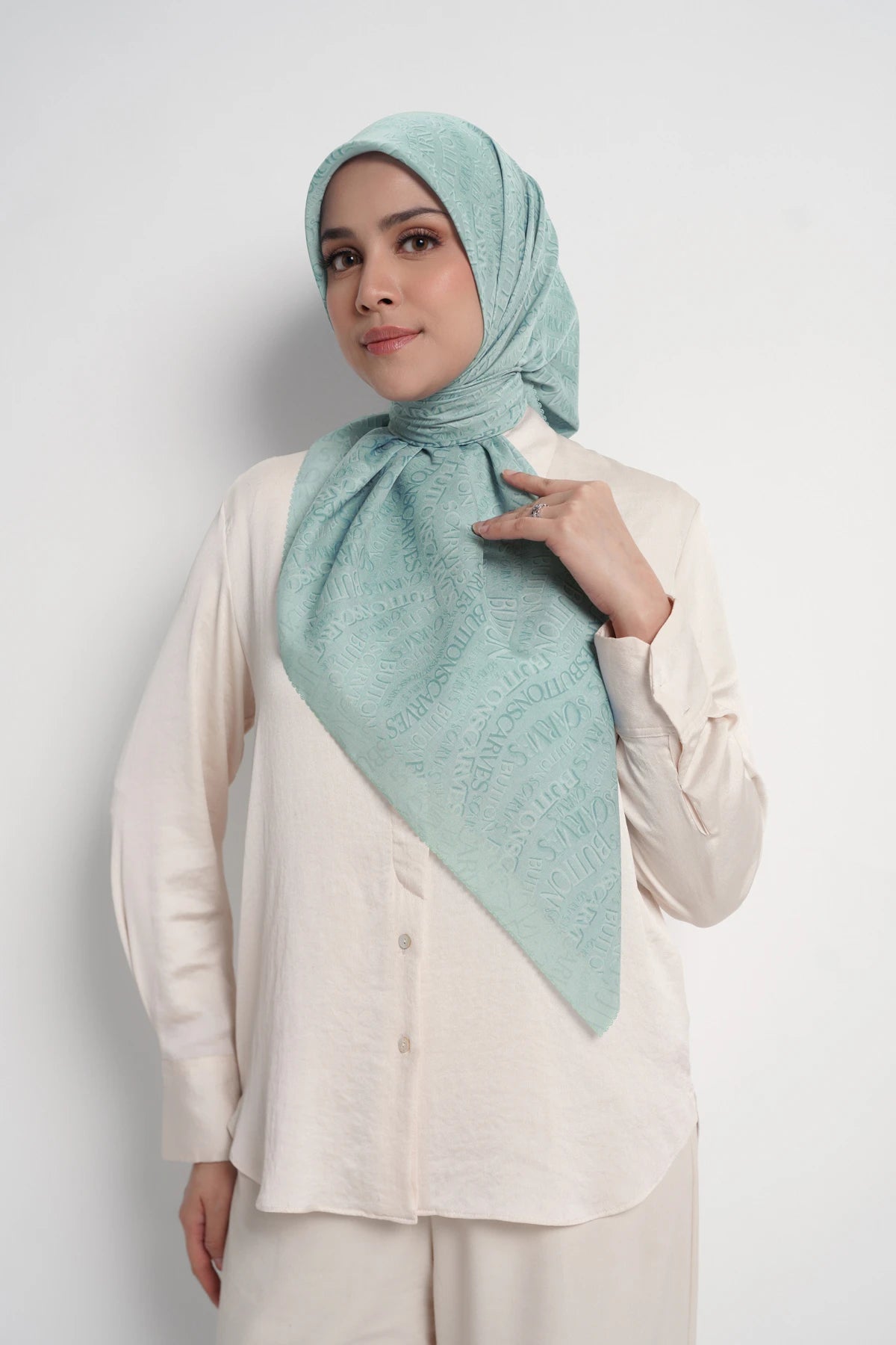 waves monogram printed square scarf in turquoise by buttonscarves front view