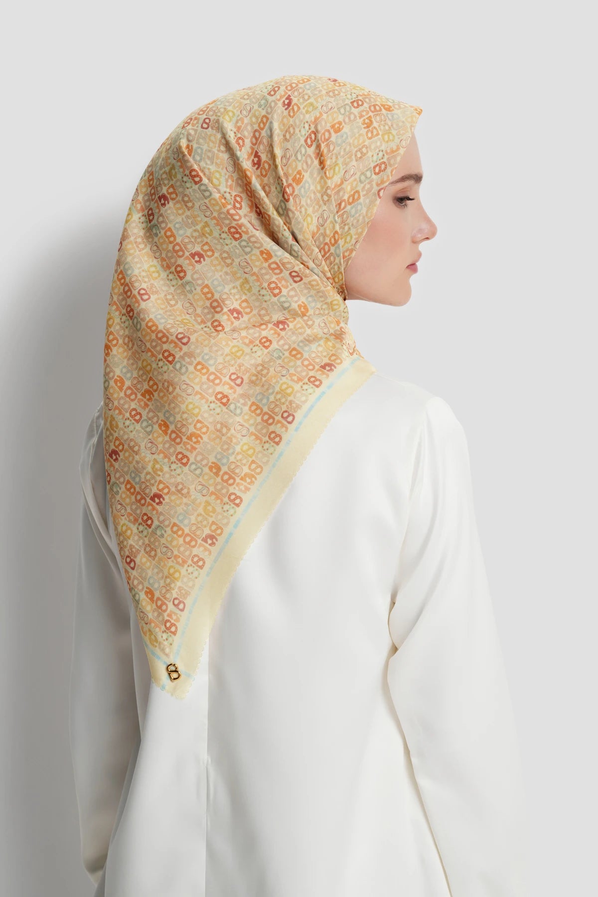 nagita square scarf in butter by buttonscarves back view