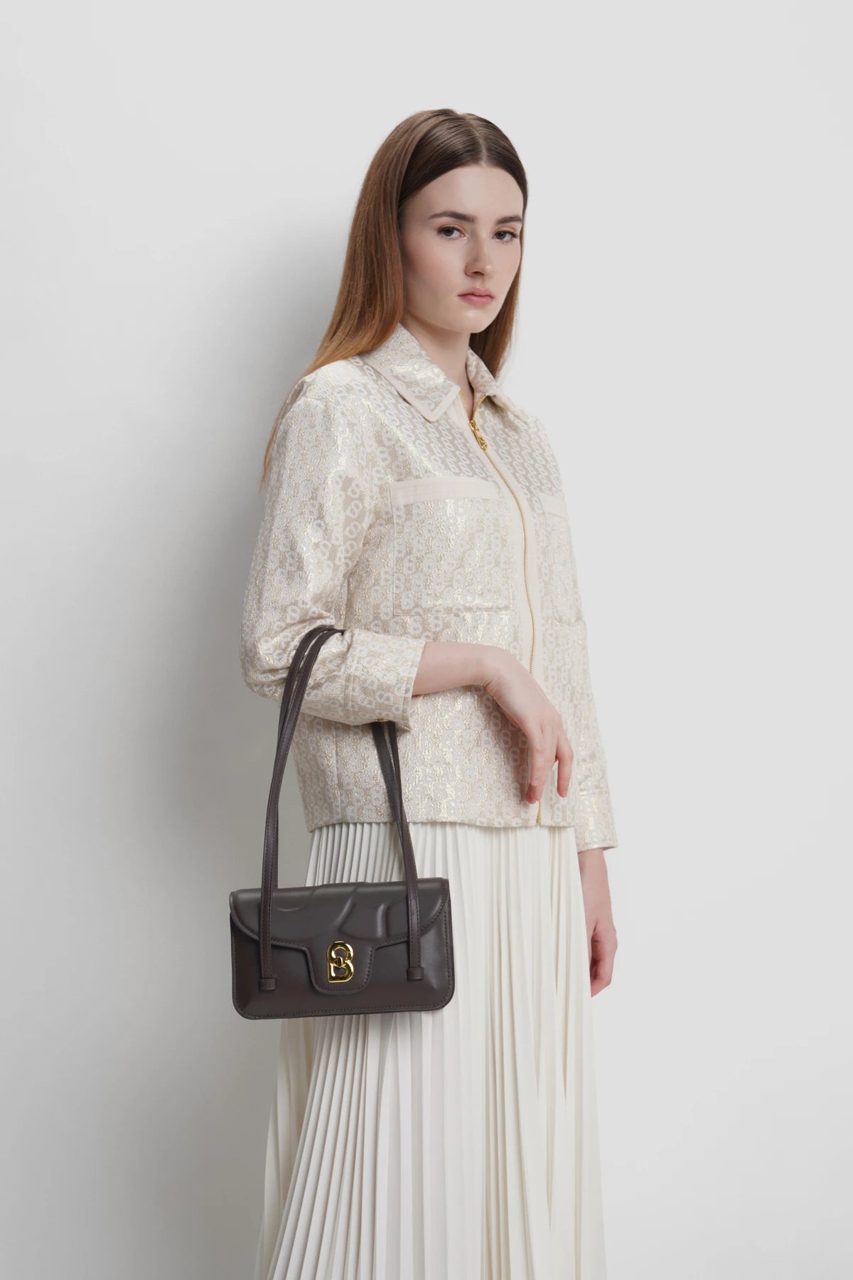 alka shoulder bag in bordeaux by buttonscarves carried on wrist