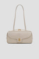 bria shoulder bag in lamb by buttonscarves front view
