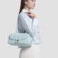 bria shoulder bag in baby blue by buttonscarves carried on shoulder