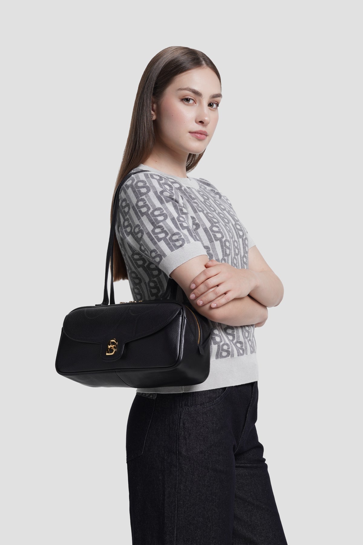 bria shoulder bag in black by buttonscarves carried on shoulder