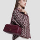 bria shoulder bag in burgundy by buttonscarves carried on shoulder