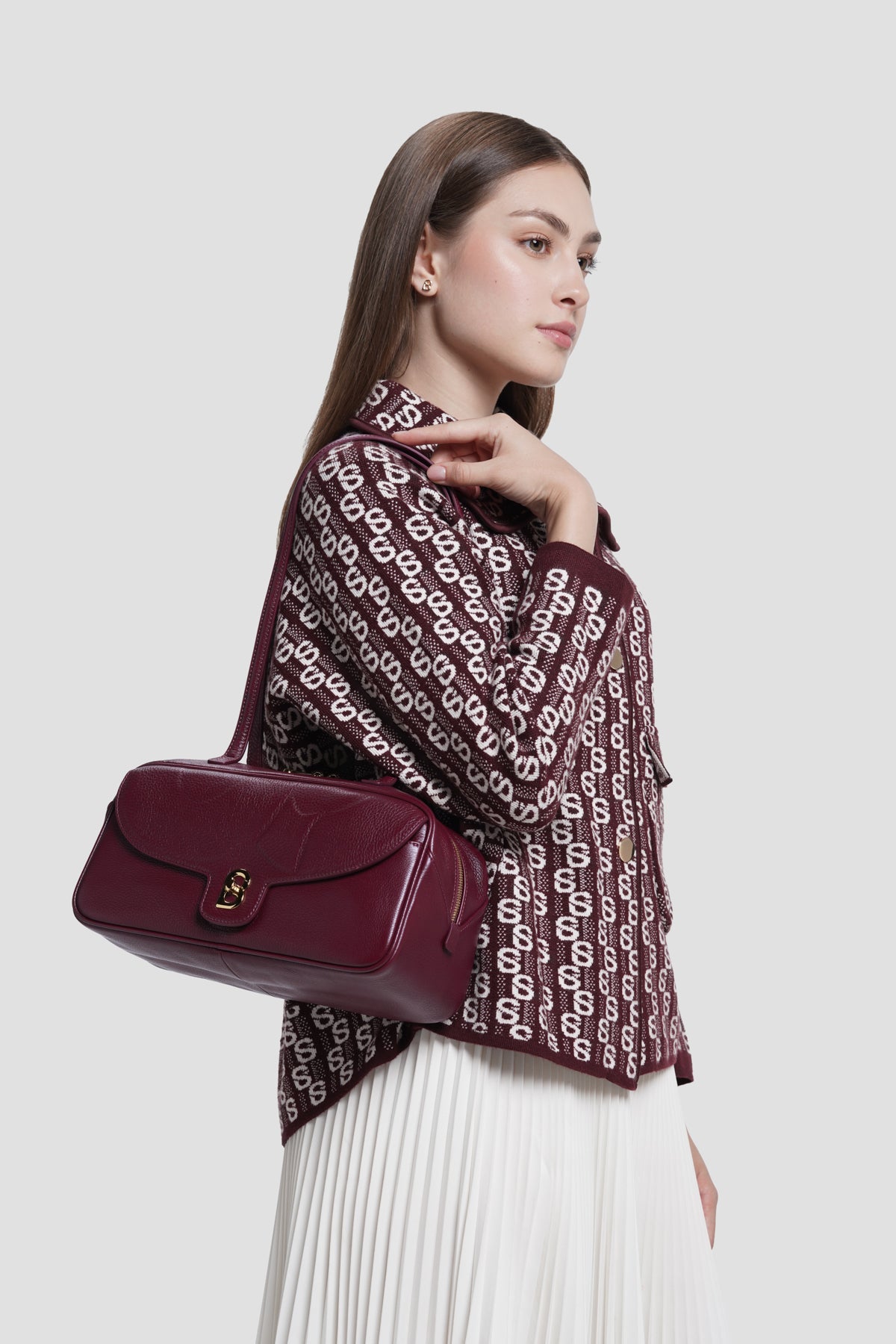 bria shoulder bag in burgundy by buttonscarves carried on shoulder