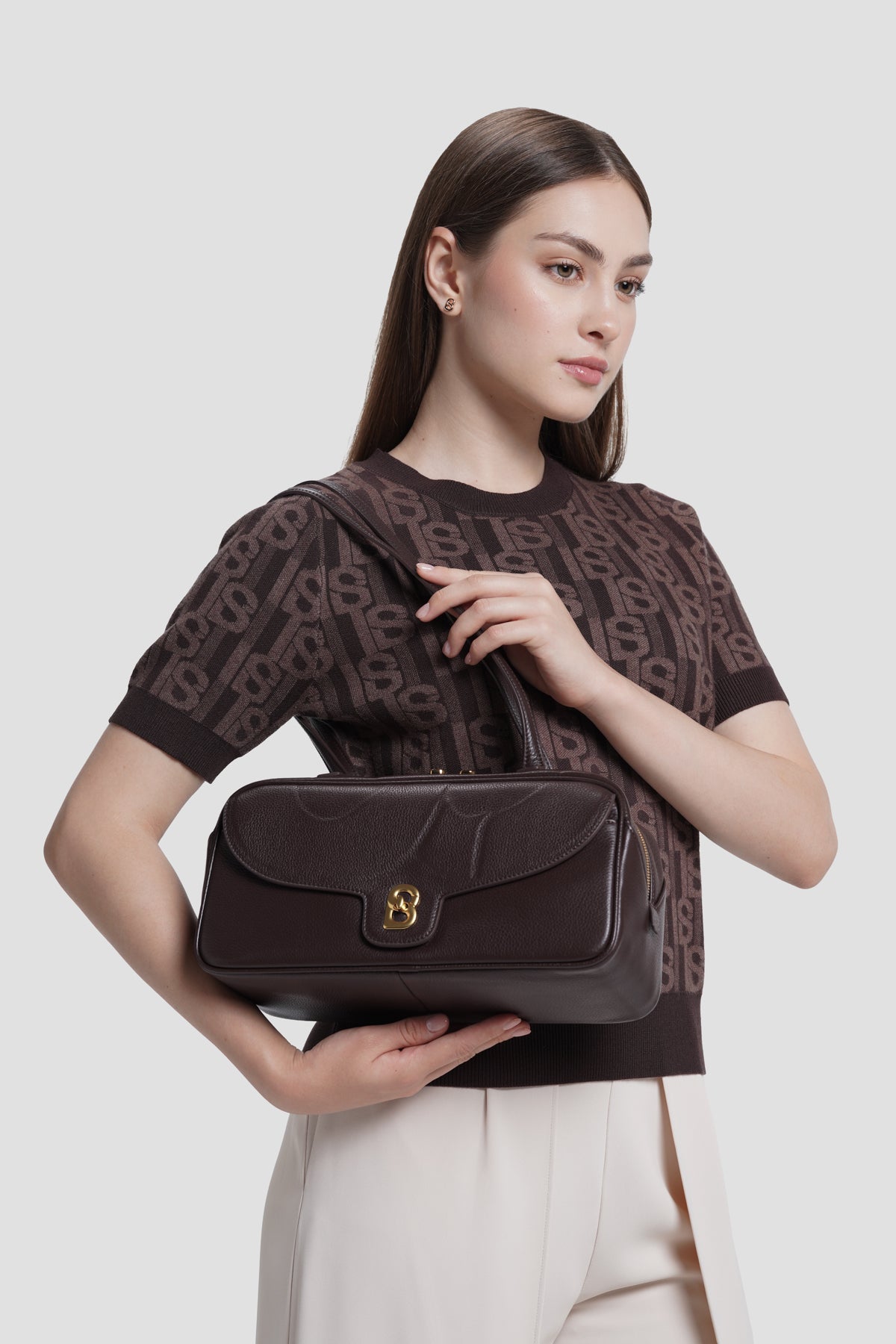 bria shoulder bag in dark brown by buttonscarves carried on shoulder