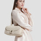 bria shoulder bag in lamb by buttonscarves carried on shoulder