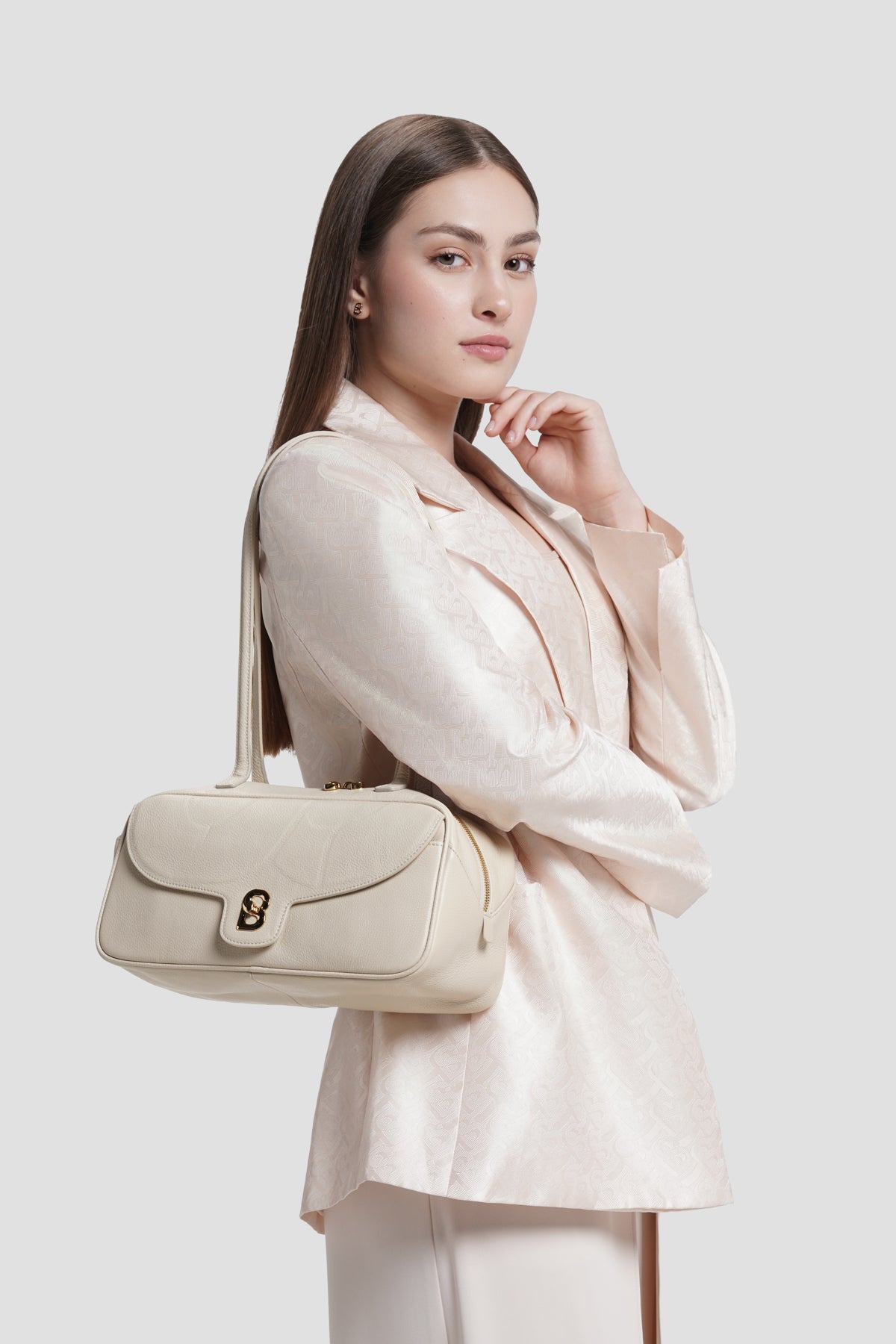 bria shoulder bag in lamb by buttonscarves carried on shoulder