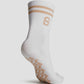 grip socks medium in beige by buttonscarves back view