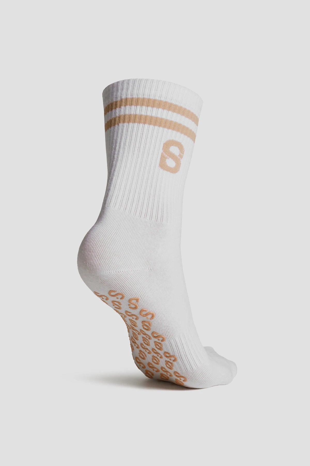 grip socks medium in beige by buttonscarves back view
