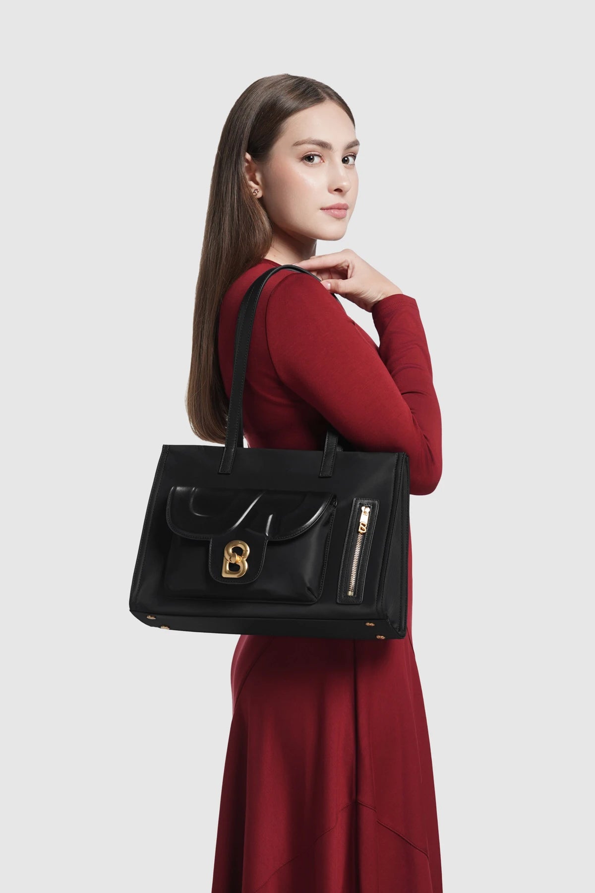 nara tote bag in black by buttonscarves carried on shoulder