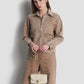 alana small bag in beige by buttonscarves carried by hand