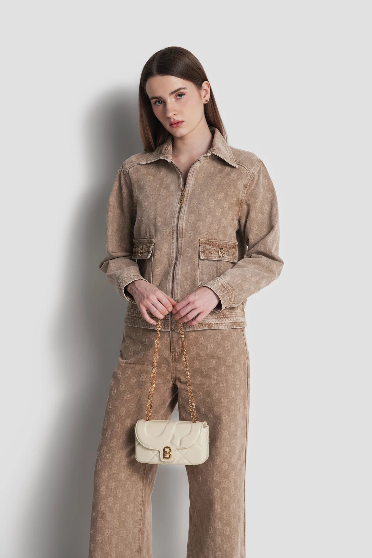 alana small bag in beige by buttonscarves carried by hand