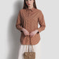 alana small bag in cappucino by buttonscarves carried by hand