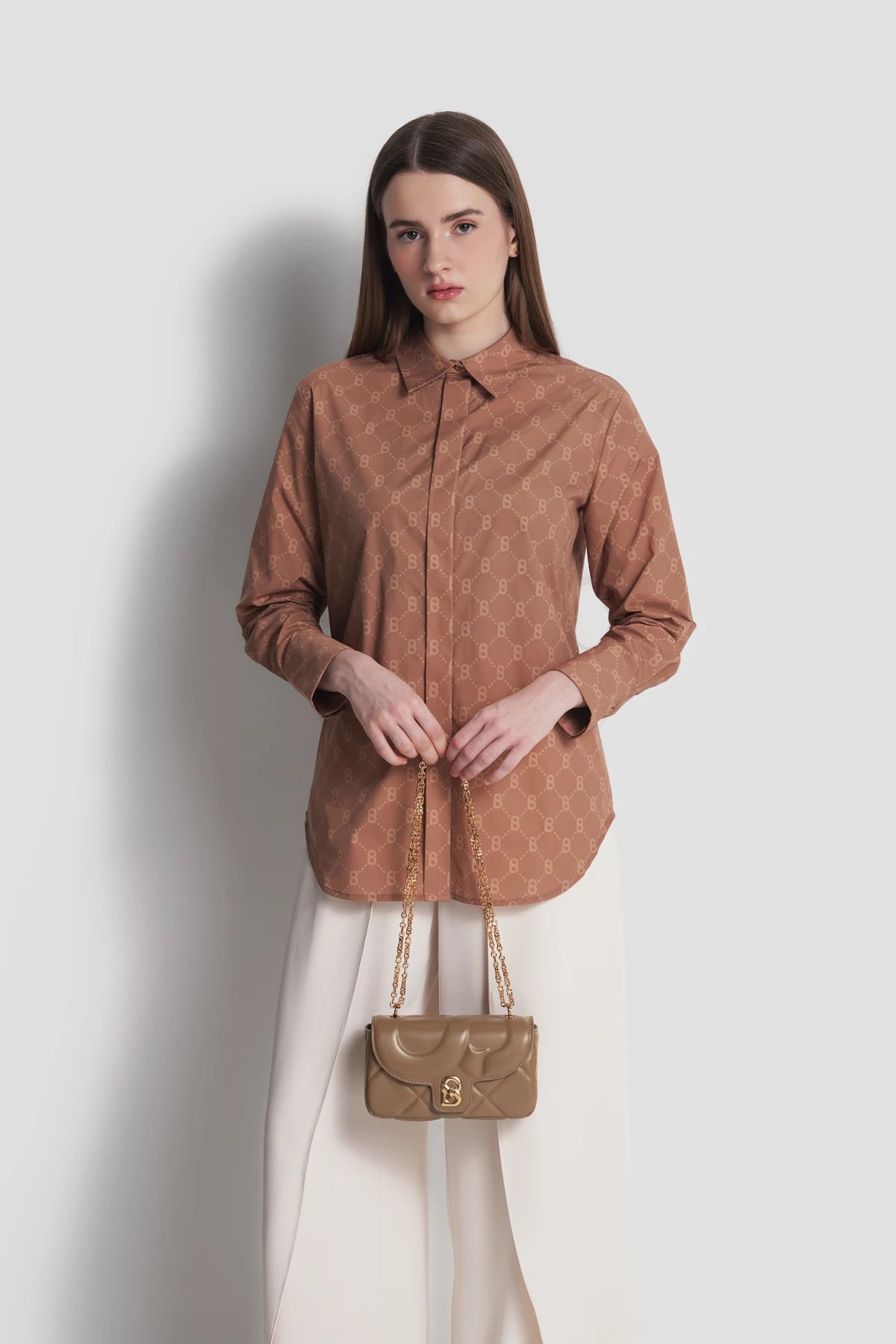 alana small bag in cappucino by buttonscarves carried by hand