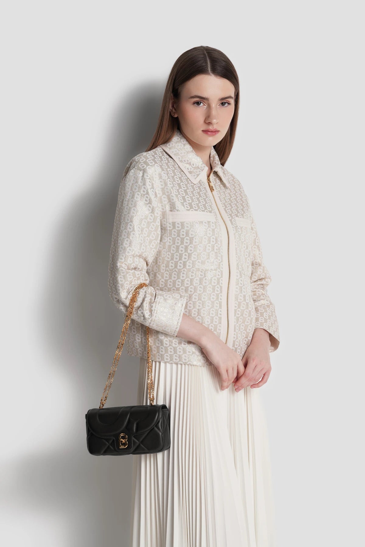 alana small bag in onyx by buttonscarves carried by hand
