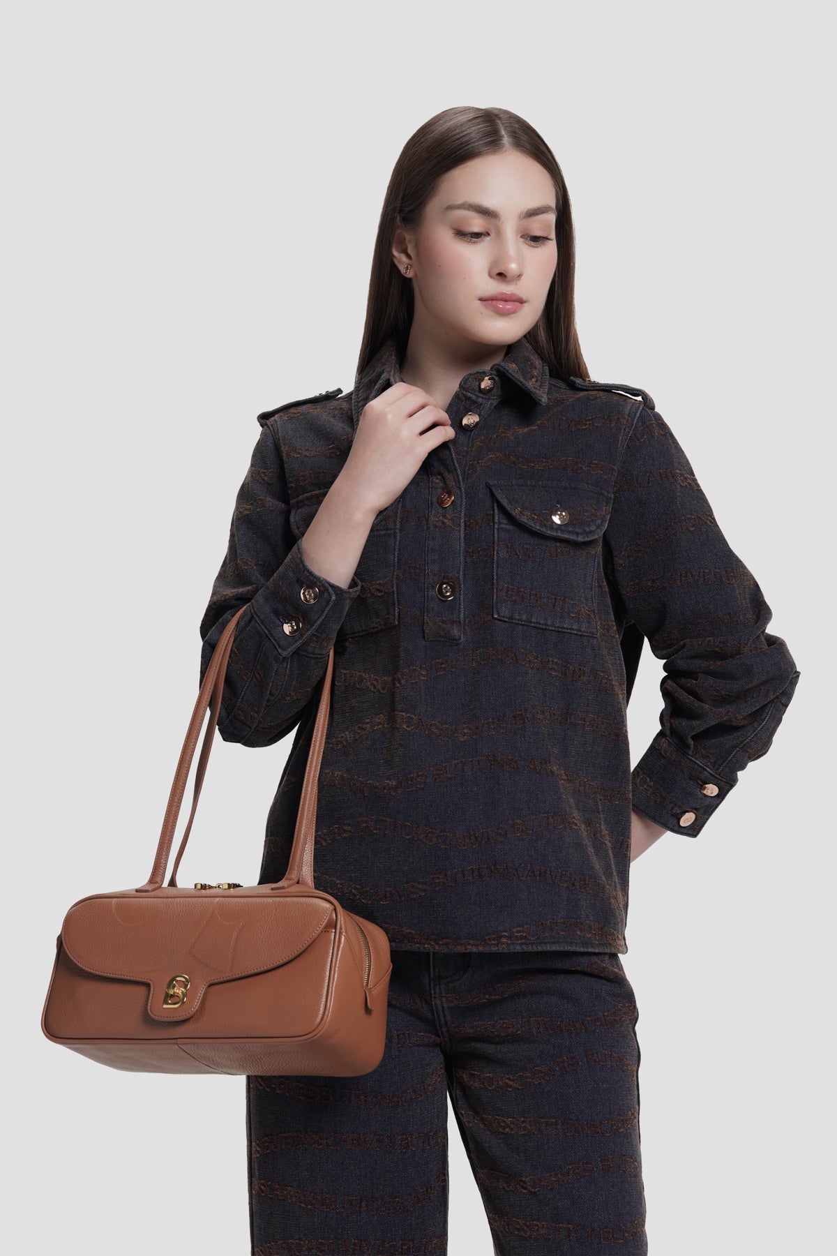 bria shoulder bag in caramel by buttonscarves carried on wrist