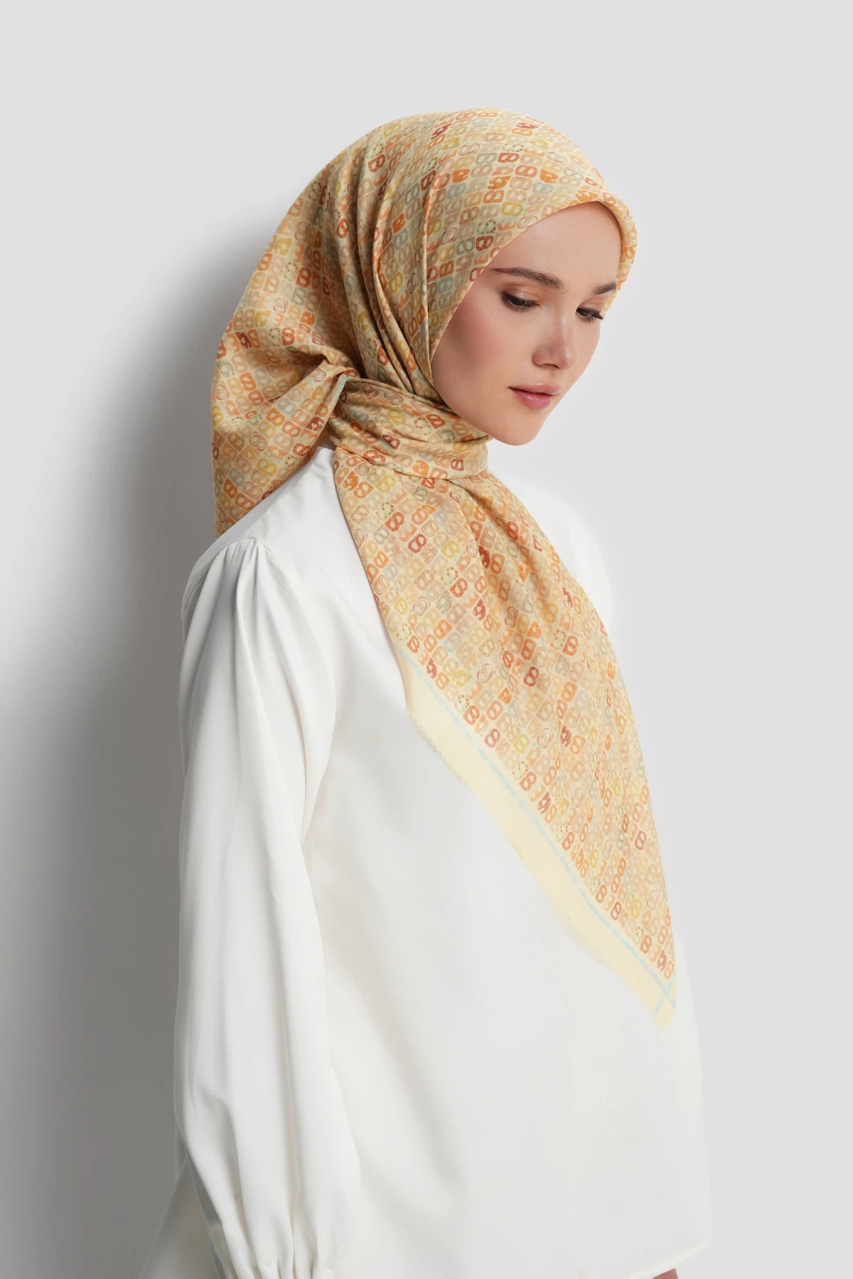 nagita square scarf in butter by buttonscarves side view