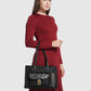 nara tote bag in black by buttonscarves carried on wrist