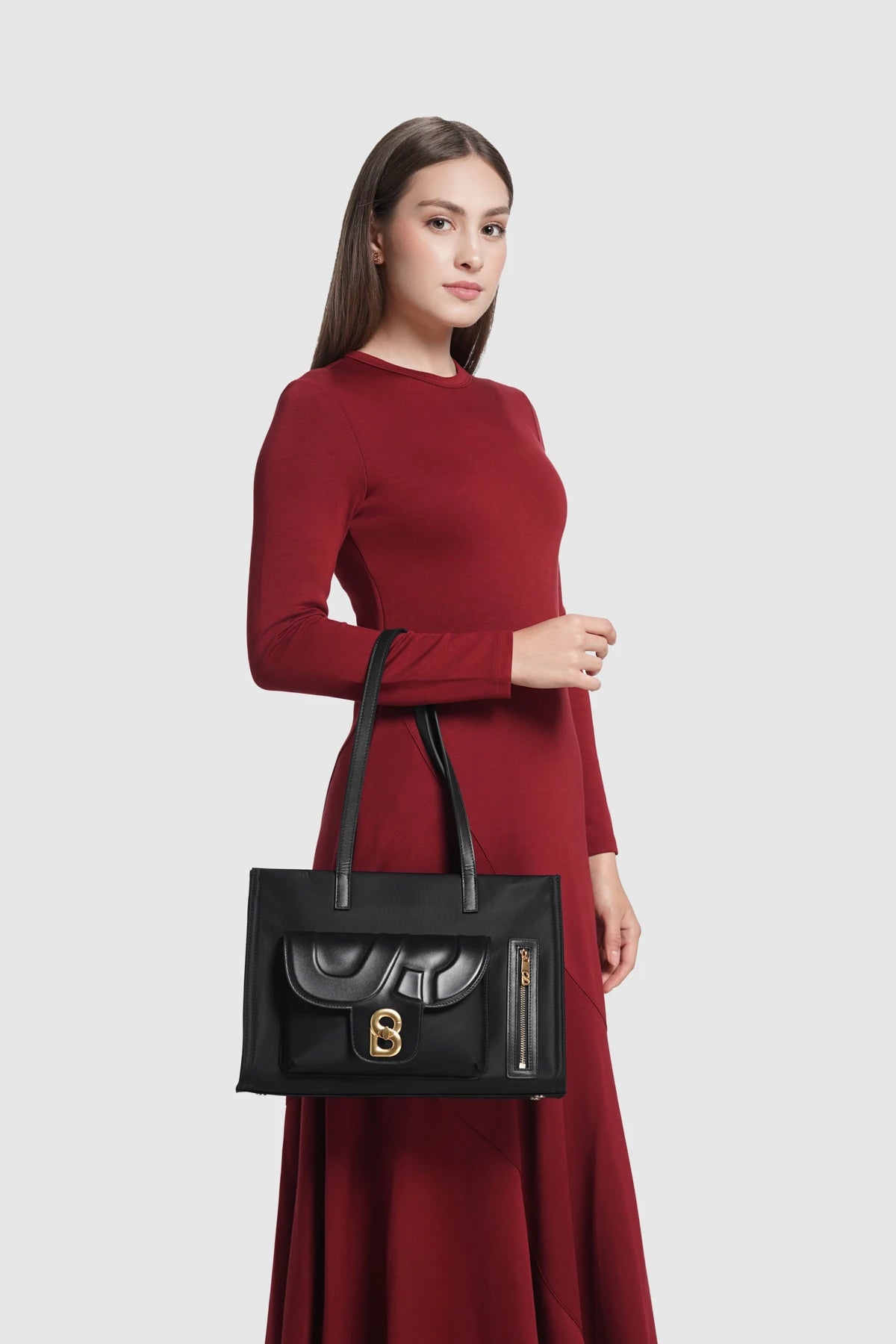 nara tote bag in black by buttonscarves carried on wrist