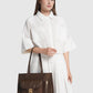 nara tote bag in brown by buttonscarves carried on wrist