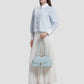 bria shoulder bag in baby blue by buttonscarves hand carried style