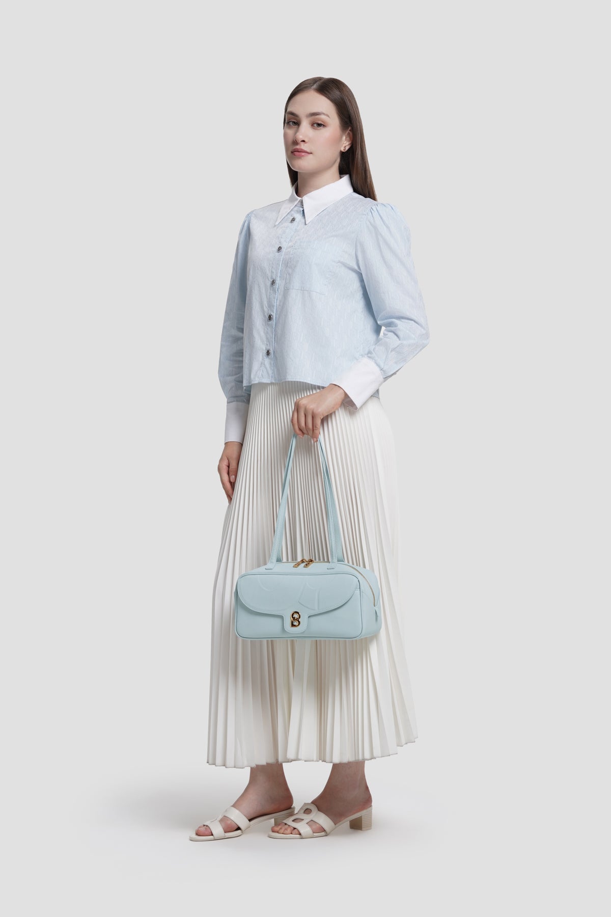 bria shoulder bag in baby blue by buttonscarves hand carried style