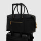 nara carryal bag in black by buttonscarves stack on suitcase 
