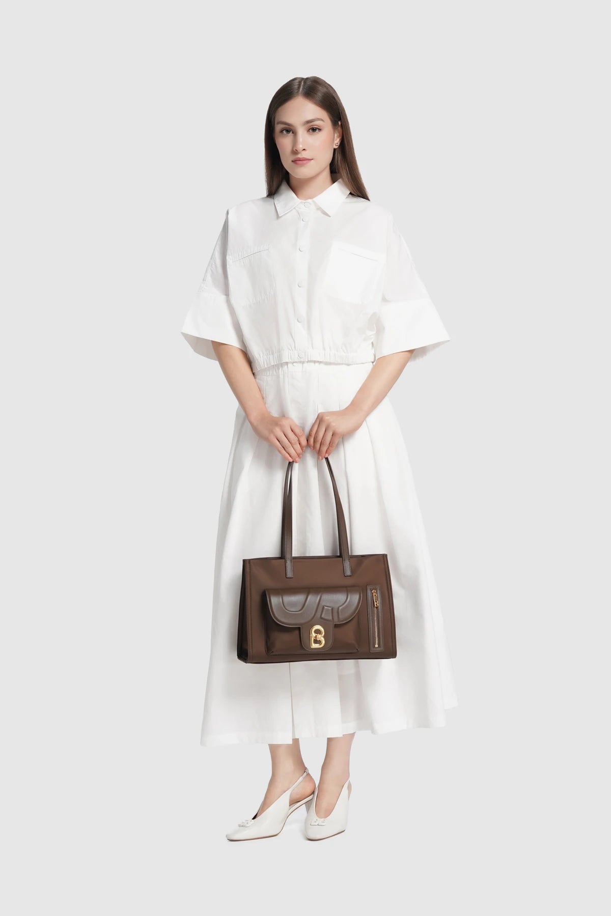 nara tote bag in brown by buttonscarves carried by hand style