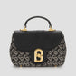 alma bimu jacquard sling bag small in black by buttonscarves front view