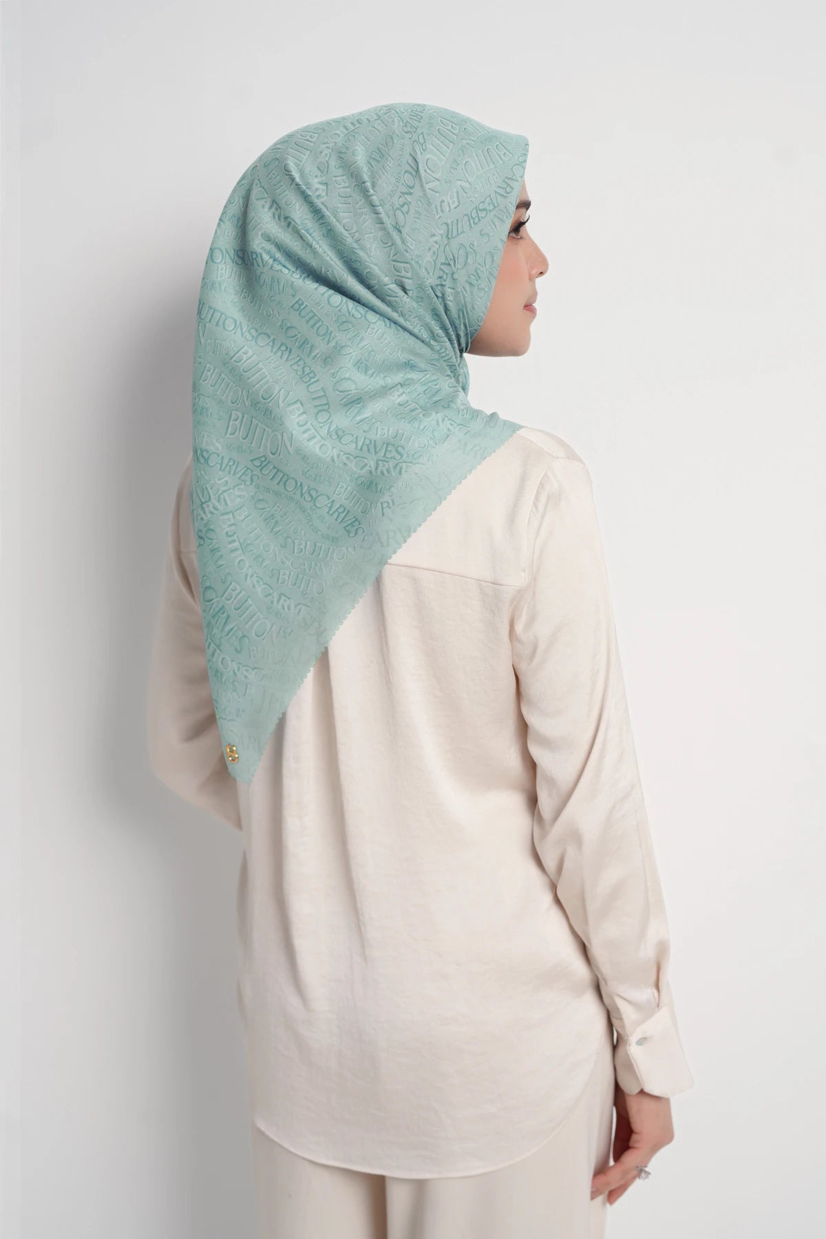 waves monogram printed square scarf in turquoise by buttonscarves back view