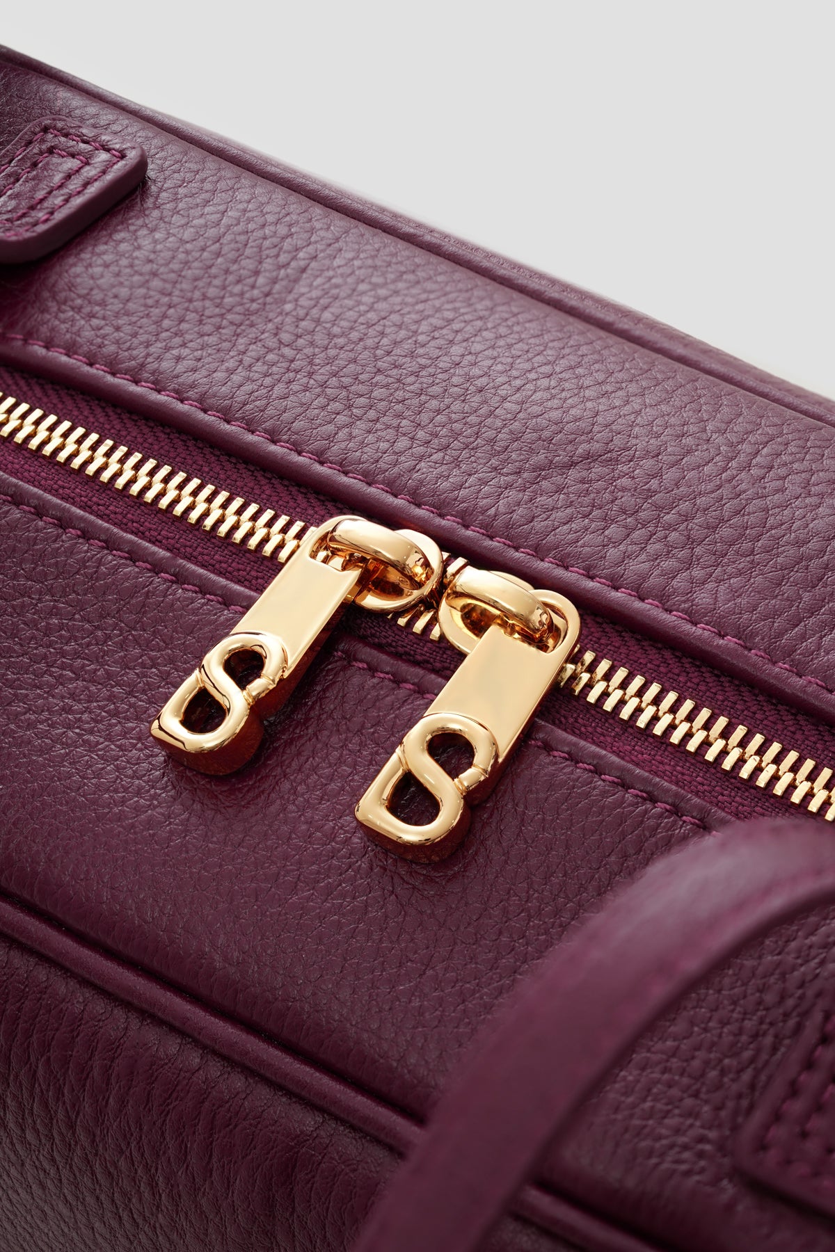 bria shoulder bag in burgundy by buttonscarves secure top zipper detail