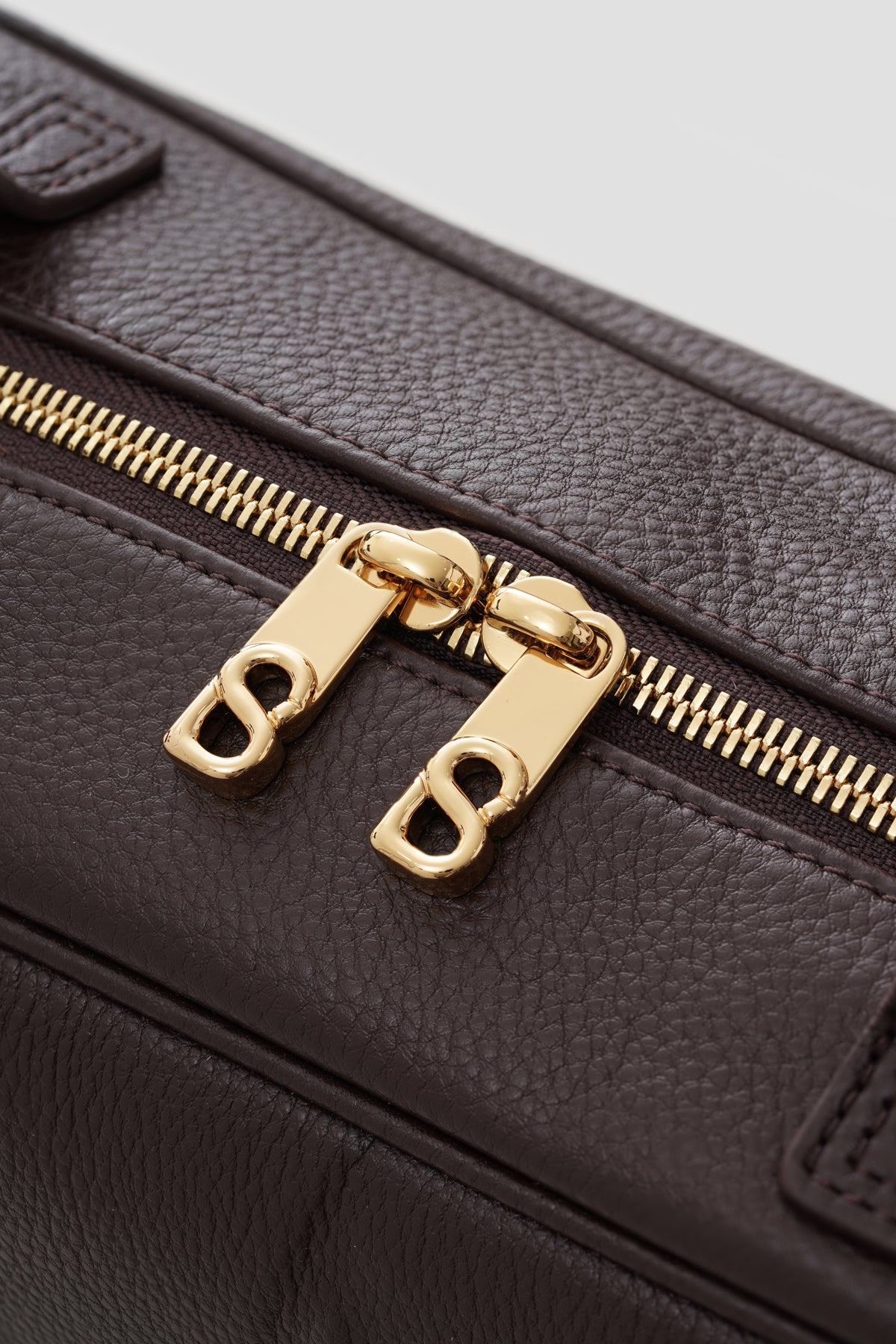 bria shoulder bag in dark brown by buttonscarves secure top zipper detail