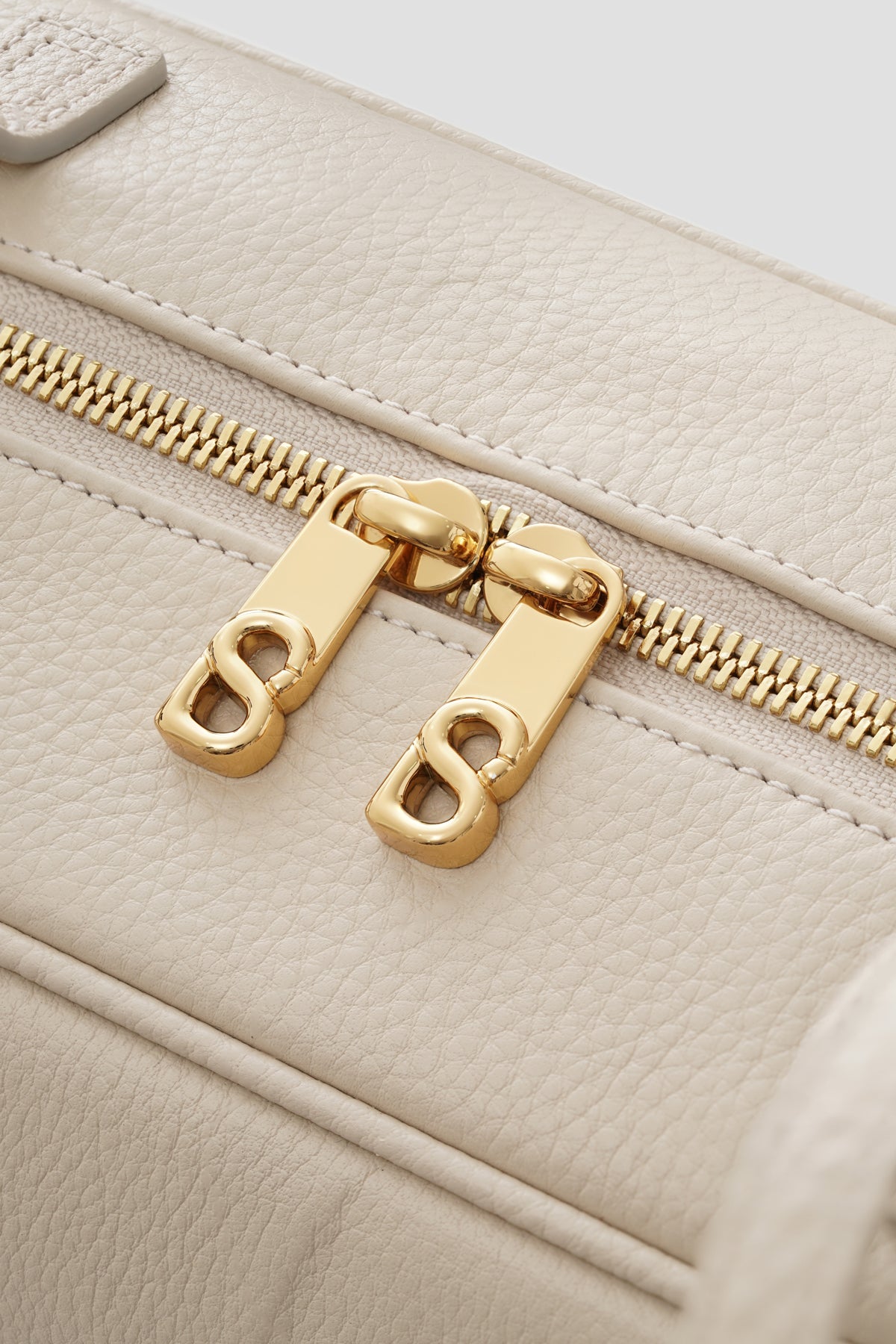 bria shoulder bag in lamb by buttonscarves secure top zipper detail