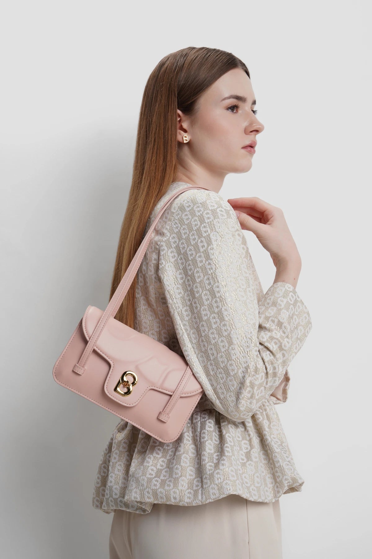 alka shoulder bag in blush pink by buttonscarves carried on shoulder