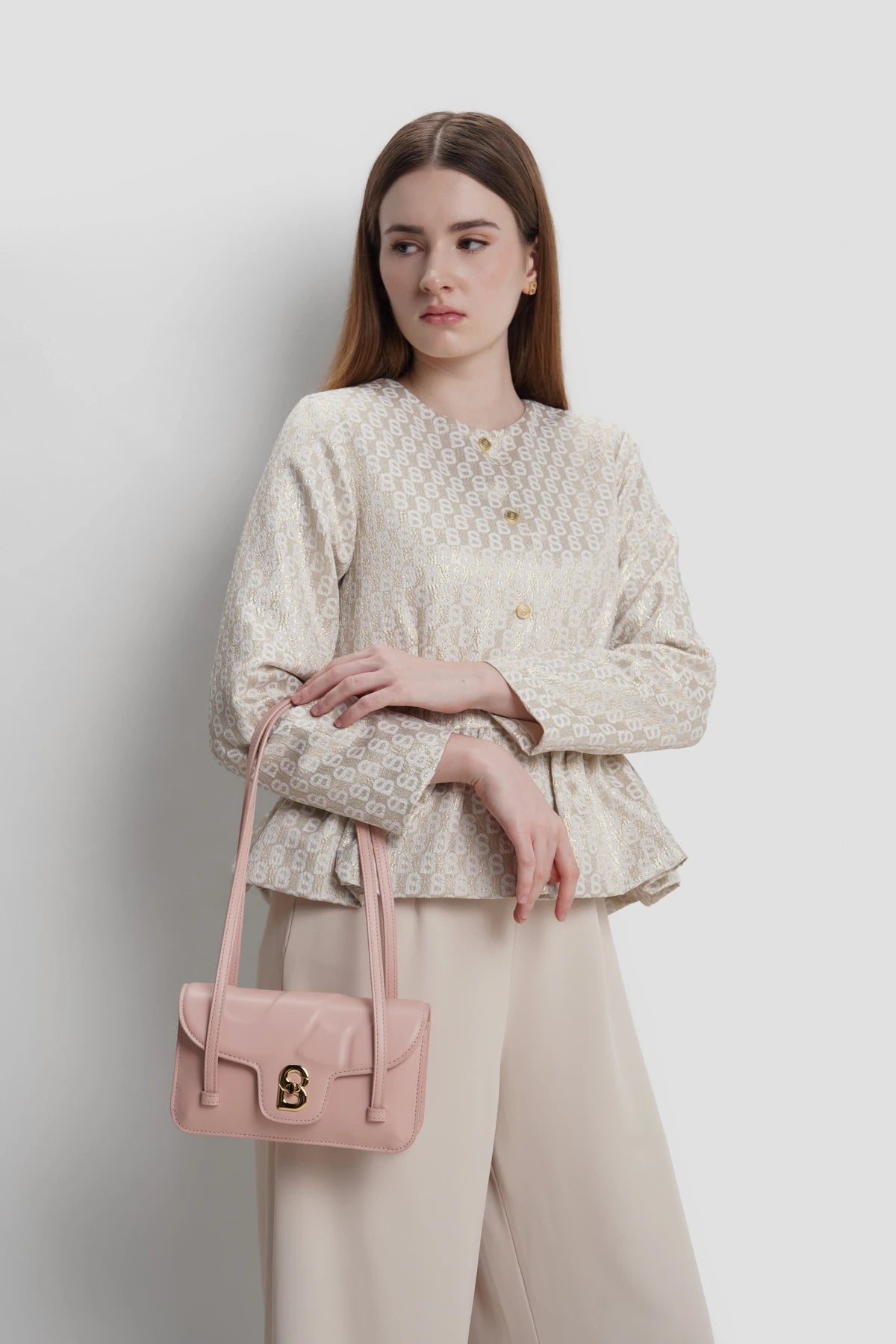 alka shoulder bag in blush pink by buttonscarves carried on wrist