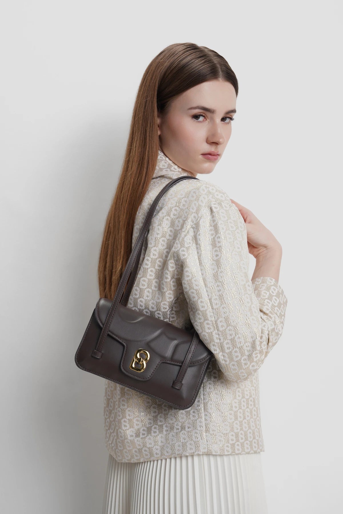 alka shoulder bag in bordeaux by buttonscarves carried on shoulder
