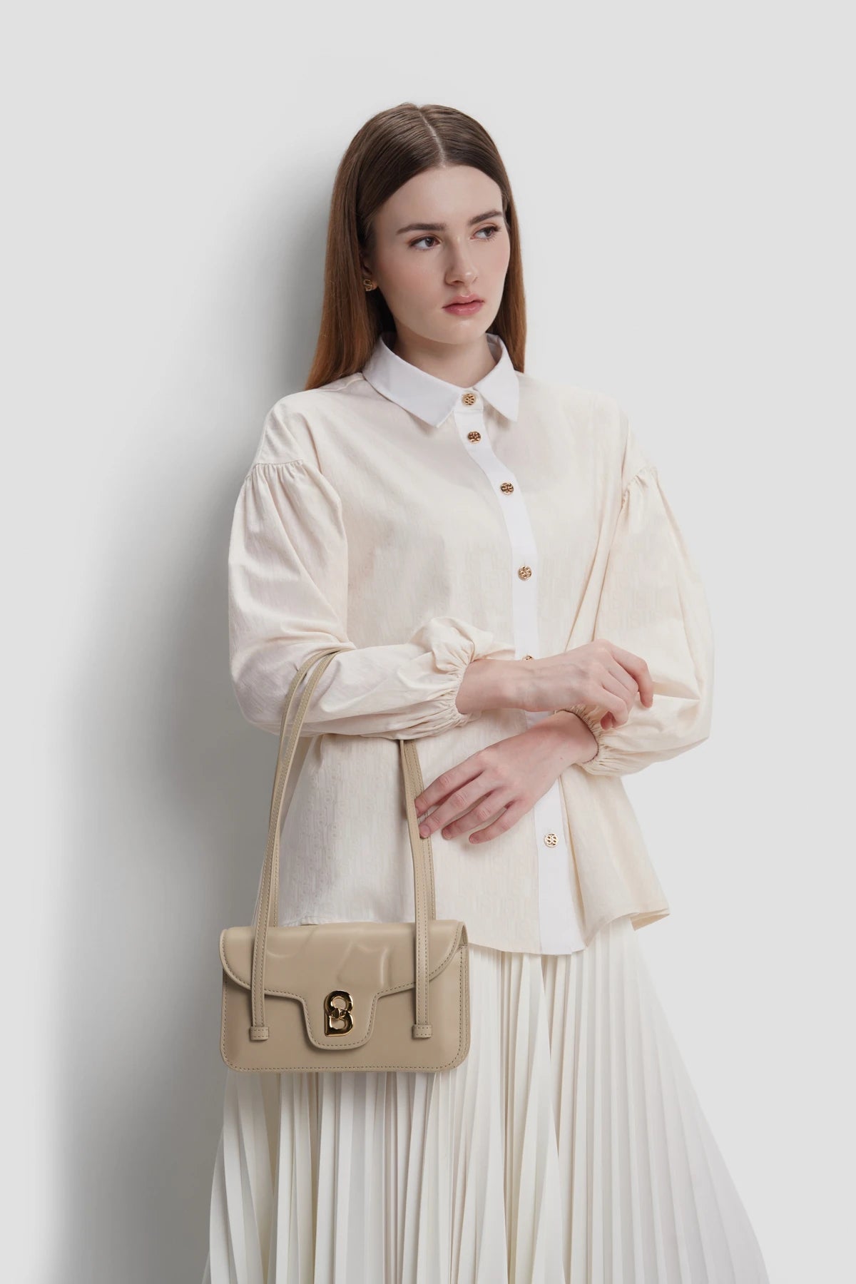 alka shoulder bag in cocoon by buttonscarves carried on wrist