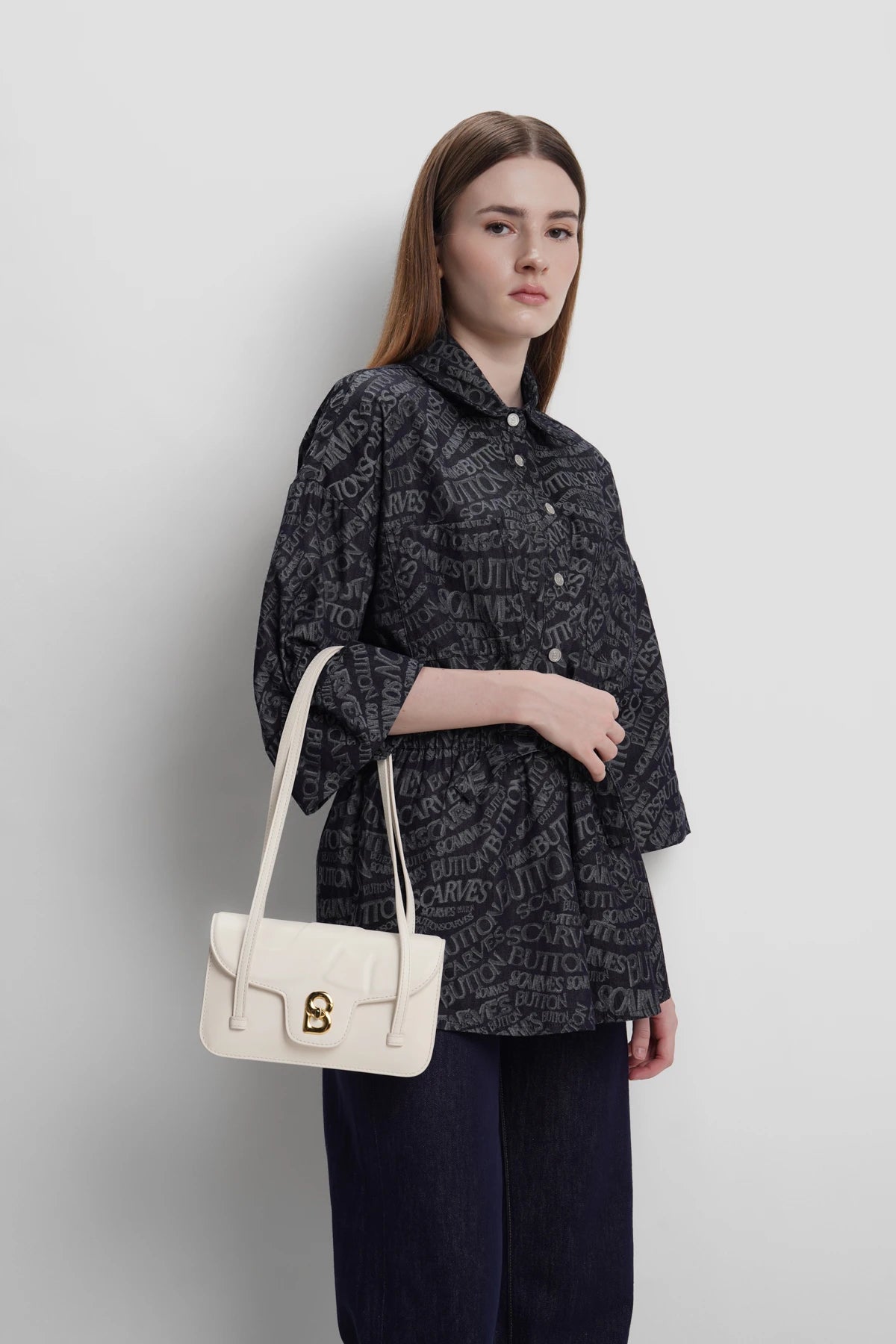 alka shoulder bag in snowdrop by buttonscarves carried on wrist