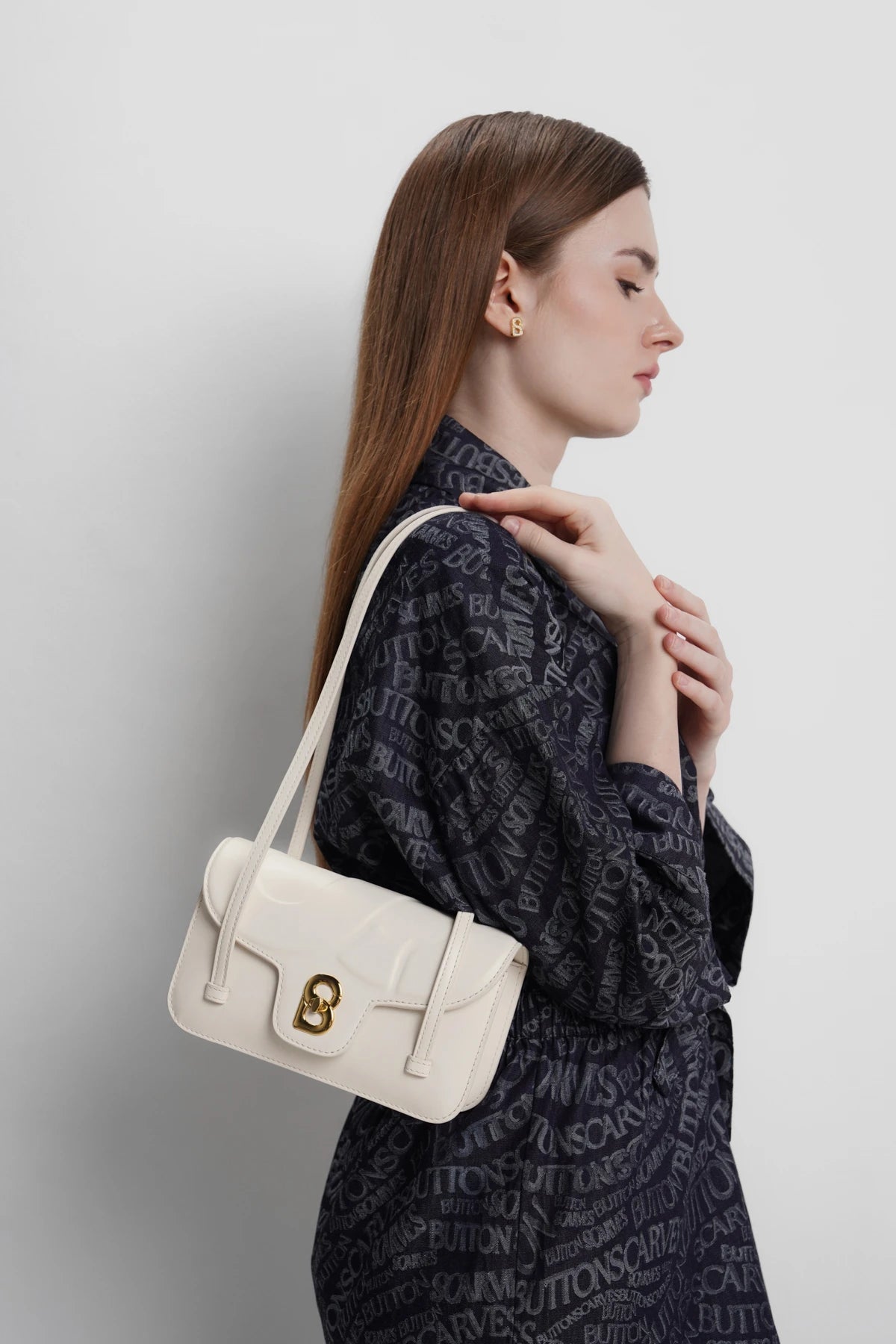 alka shoulder bag in snowdrop by buttonscarves carried on shoulder