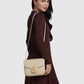 Model memakai tas Buttonscarves Alba Bag Medium warna putih chalk