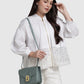 Model memakai tas Buttonscarves Alba Bag Medium warna hijau 