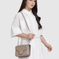 Model memakai tas Buttonscarves Alba Bag Medium warna Taupe